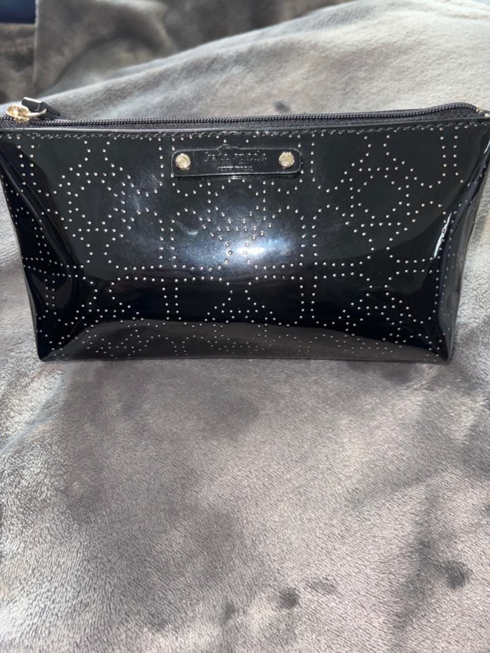 kate spade glossy black cosmetic pouch with perforated logo